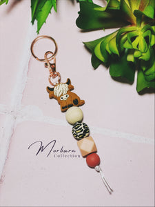 Leopard Highland Cow key ring